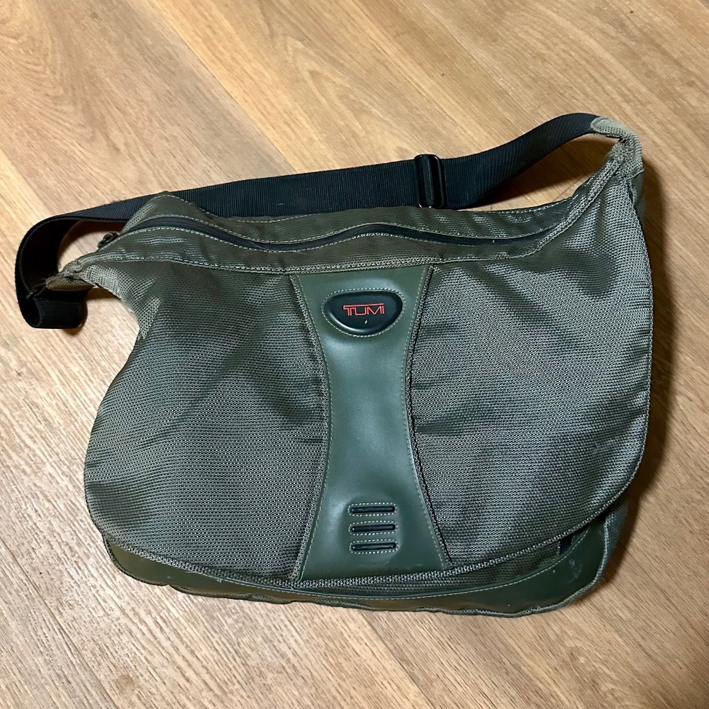 Pewter Silver TUMI messenger bag.